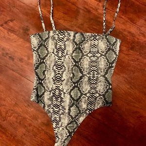 Laura’s Boutique snake bodysuit